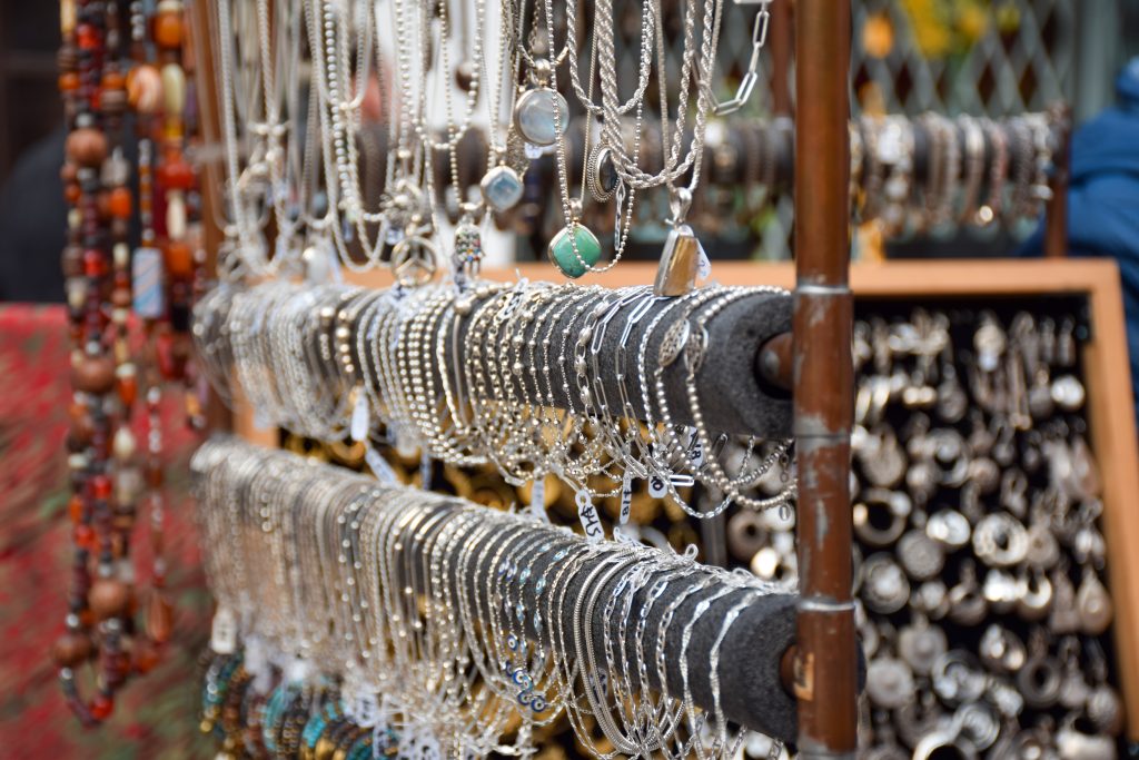 Handmade artisanal jewelry and accessories at a street market
